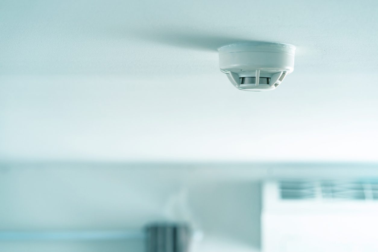 Smoke Fire Detector Against a ceiling.