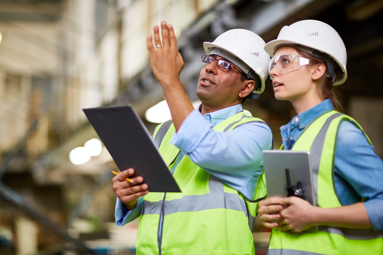 Two security engineers conducting a site audit.