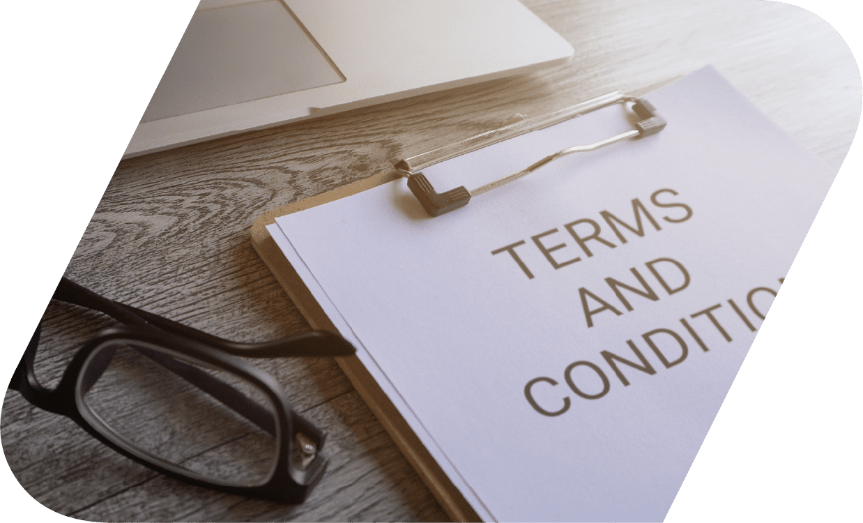 Terms and conditions document on a clipboard.