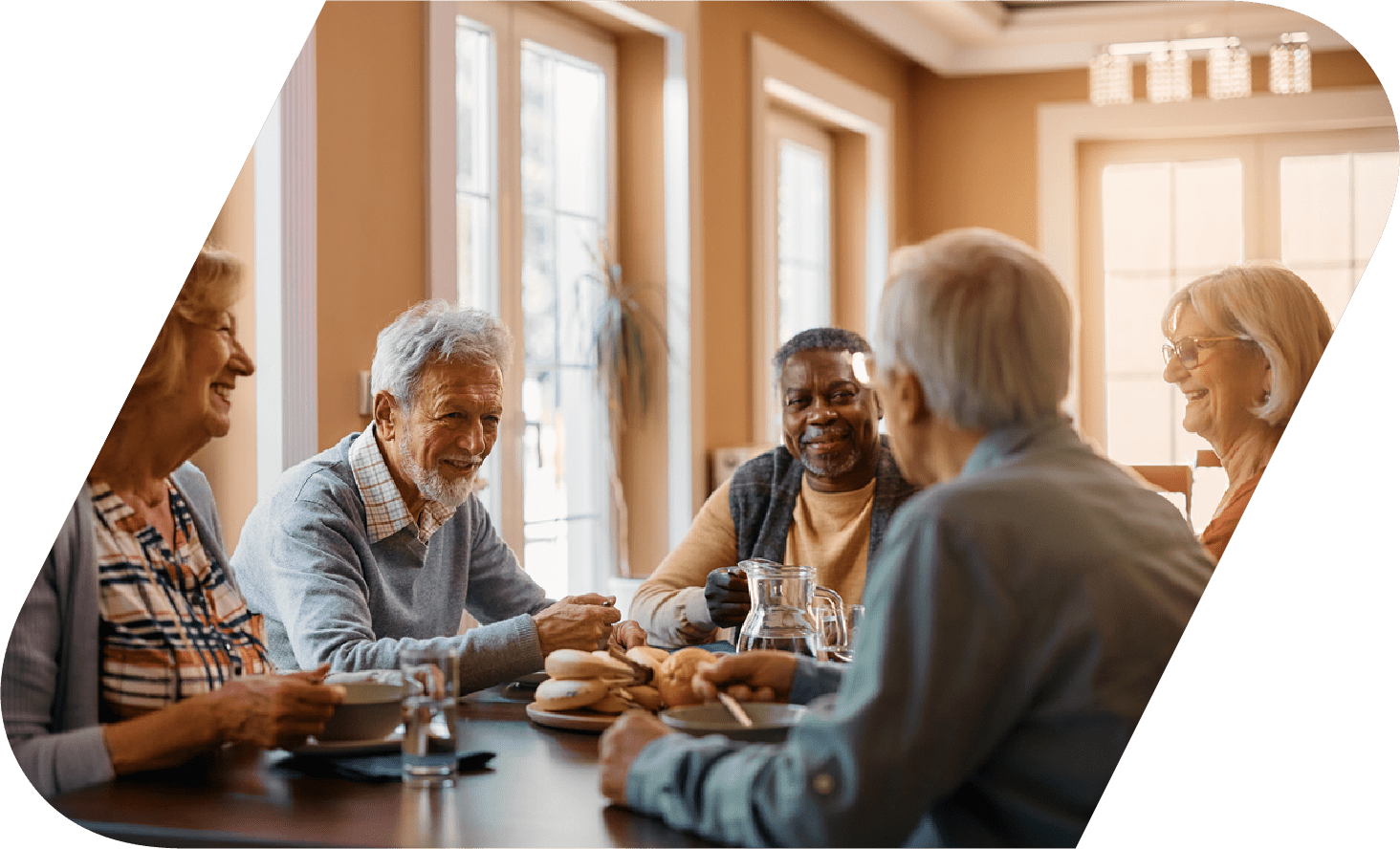 Senior citizens sitting around a table.