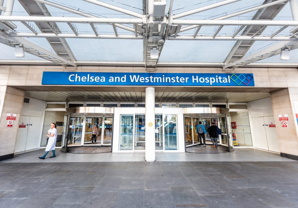 Neighborhood District Of Chelsea, Street, Modern Architecture, Sign For Westminster Hospital Entrance Doors, People