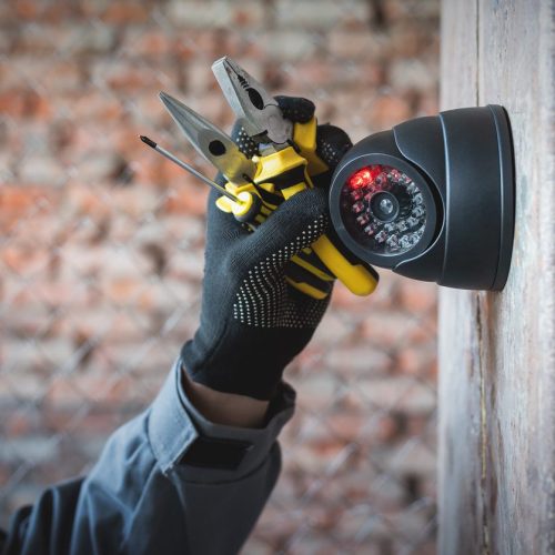 Technician fitting Security Camera.