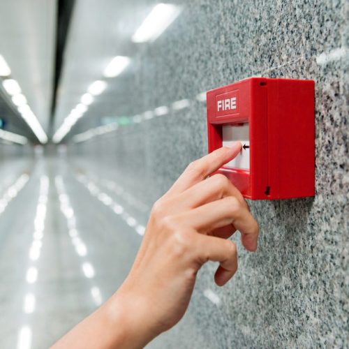 Human Finger Pushing Fire Alarm