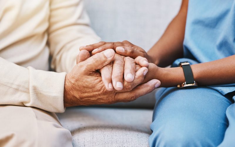 Nurse, Hands And Senior Patient In Empathy, Safety And Support Of Help, Trust And Healthcare Consulting. Nursing Home, C