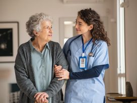 Nurse smiling at older patient