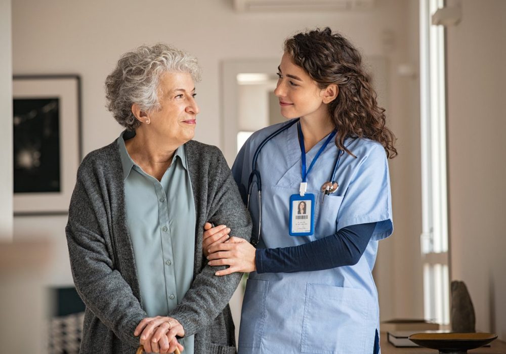 Nurse smiling at older patient