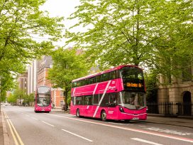 Pink Bus In Victorian Street In Central Belfast